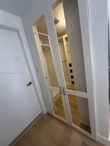 a bathroom with a granite countertop sink toilet and mirror