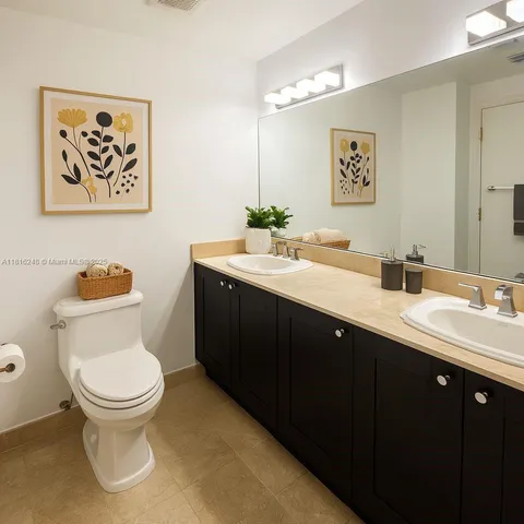 a bathroom with a sink double vanity and a mirror