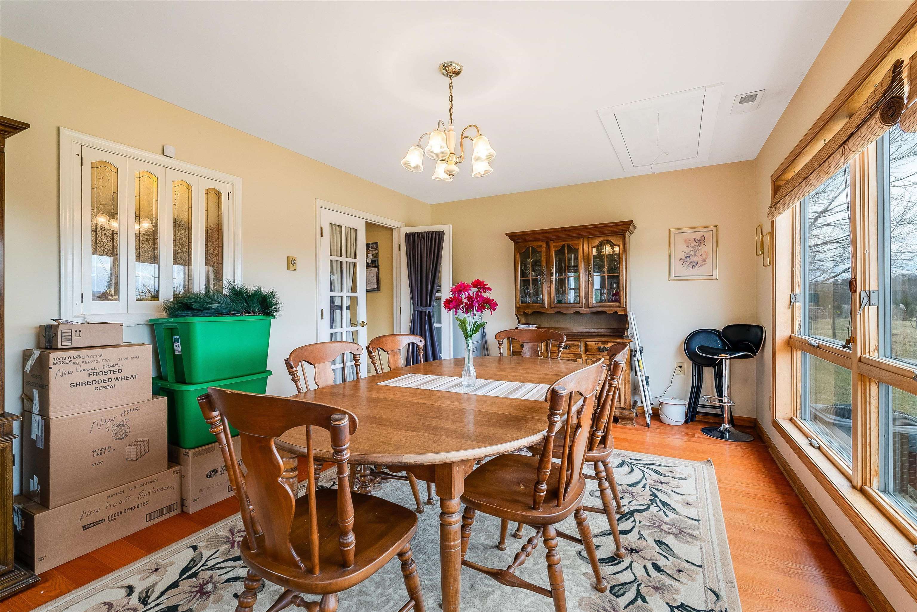 1577 Dam Town Road Fort Defiance, VA 24437 - Photo 13 of 68 a view of a dining room with furniture a chandelier and wooden floor