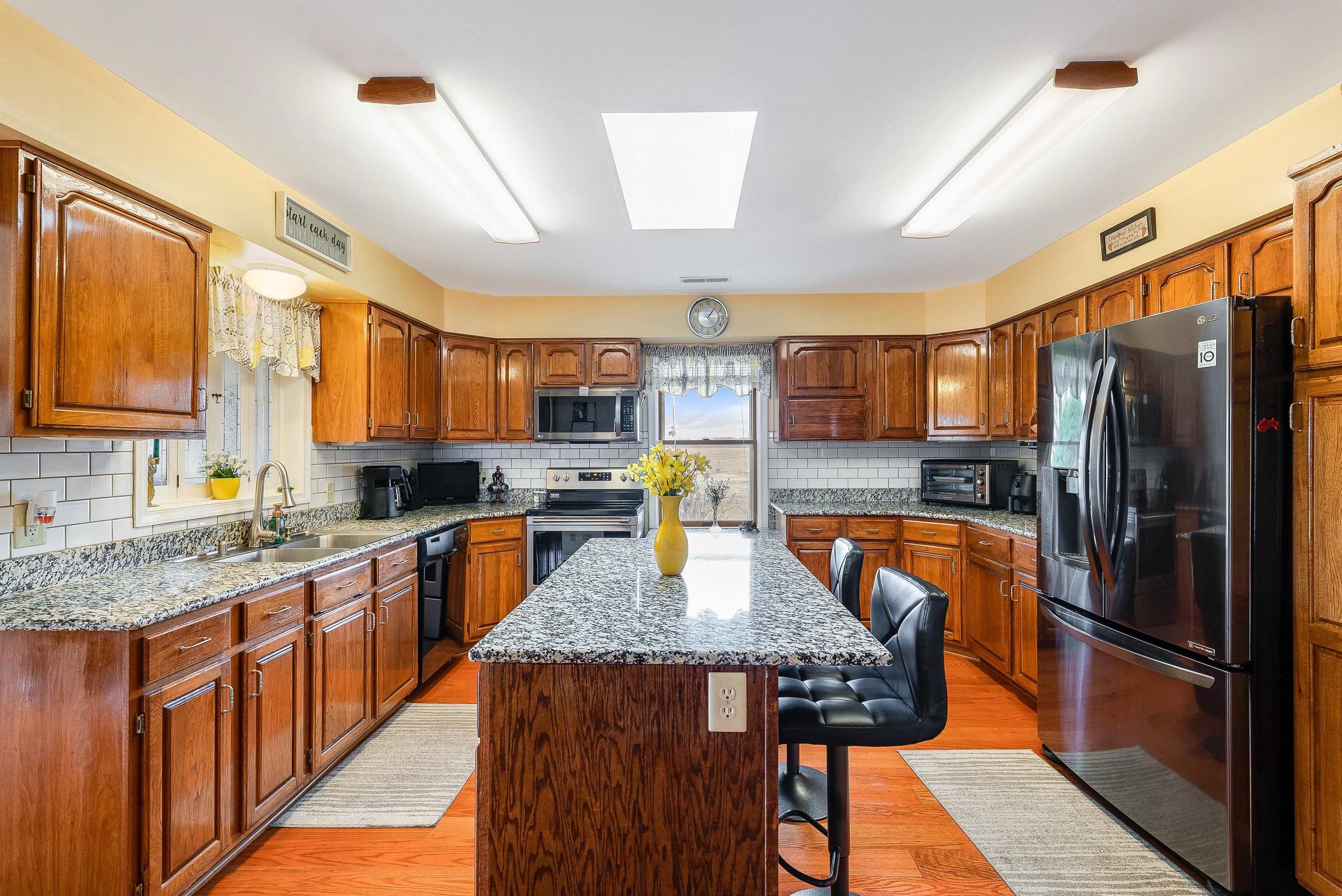 1577 Dam Town Road Fort Defiance, VA 24437 - Photo 6 of 68 a kitchen with stainless steel appliances granite countertop a stove refrigerator sink and cabinets