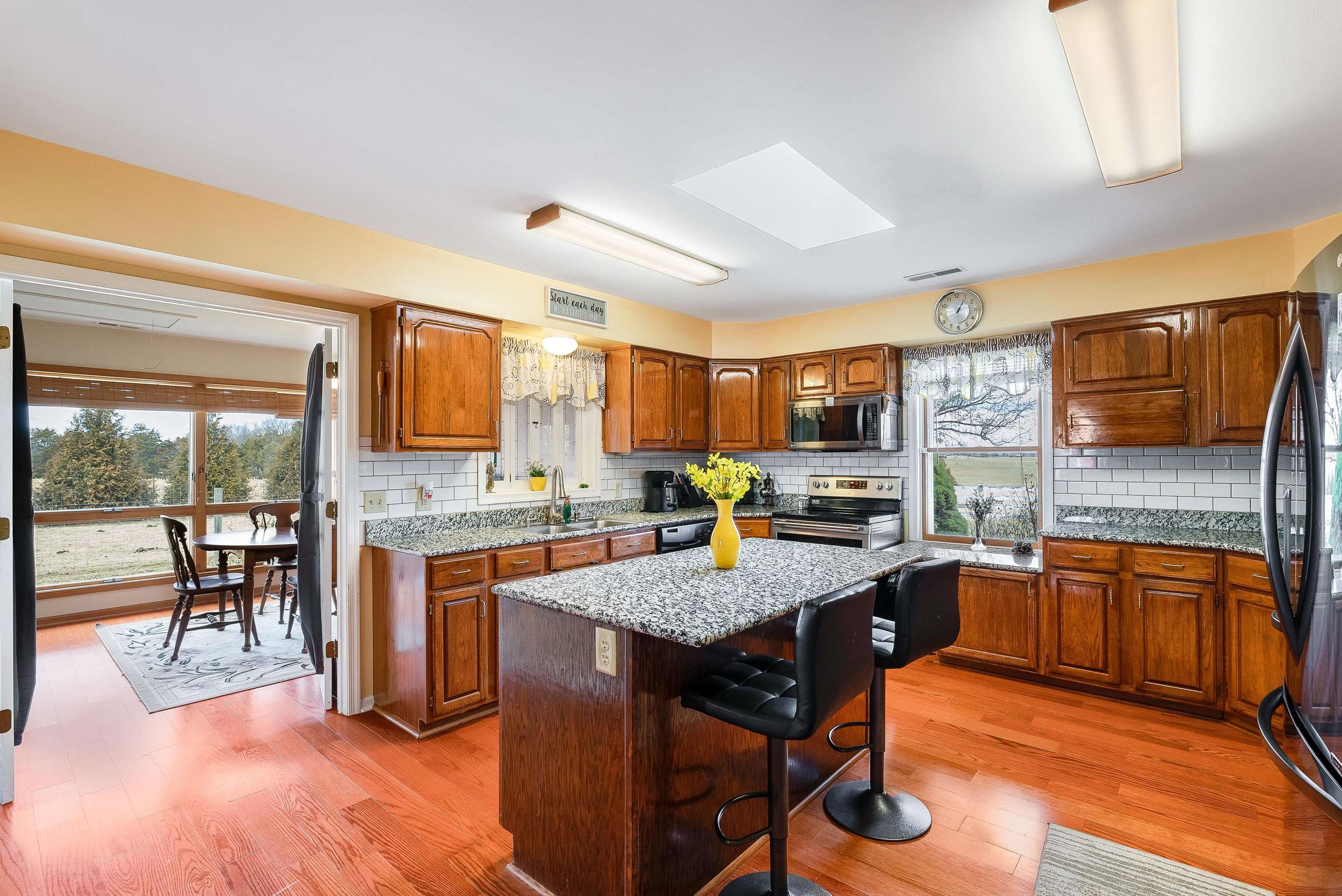 1577 Dam Town Road Fort Defiance, VA 24437 - Photo 10 of 68 a kitchen with granite countertop lots of counter top space and dining table