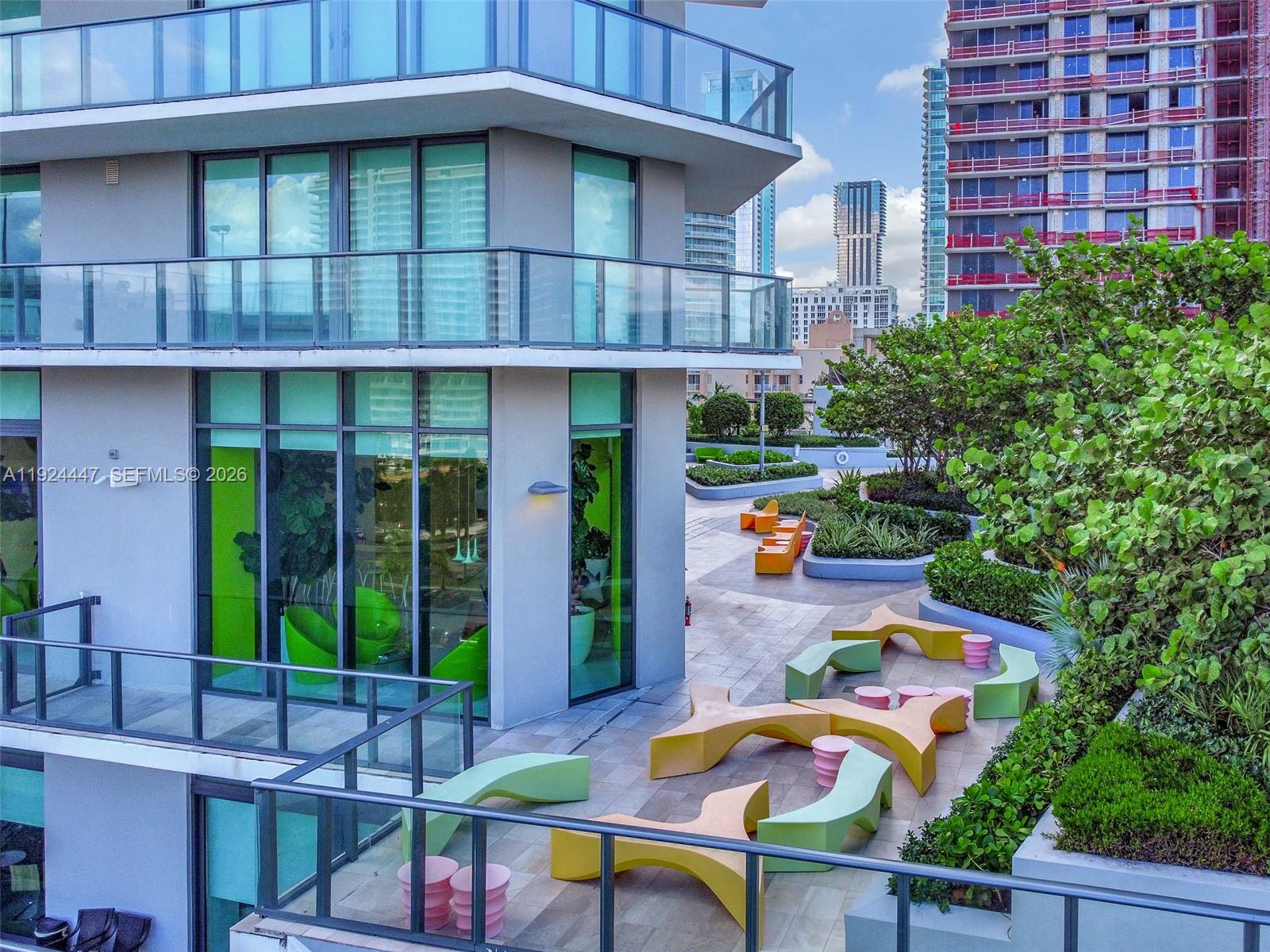 501 Northeast 31st Street, Unit 2902 Miami, FL 33137 - Photo 19 of 36 a view of a chairs and table in the patio