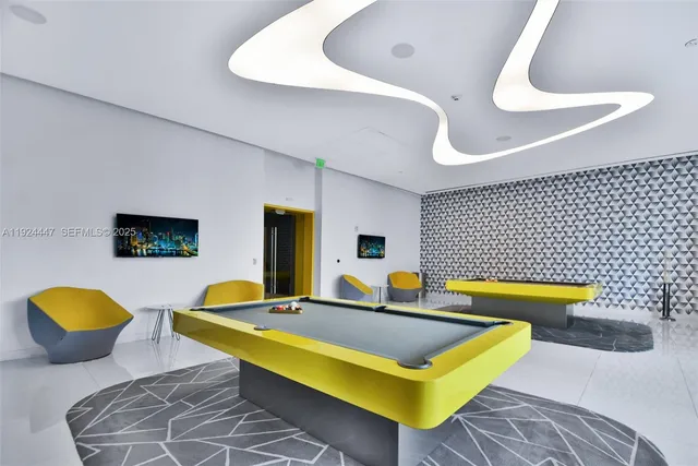 a living room with hard wood flooring