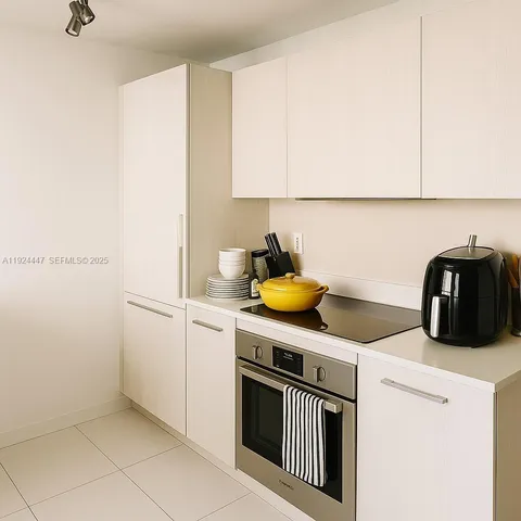 a kitchen with a sink and a stove
