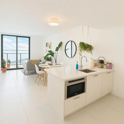 a living room with furniture a fireplace and white walls