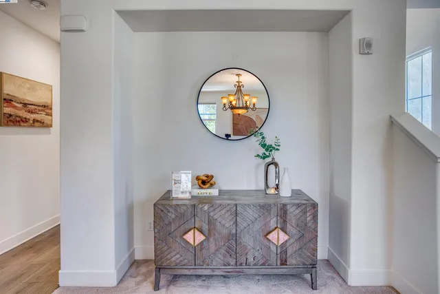 a clock on a wall next to a window