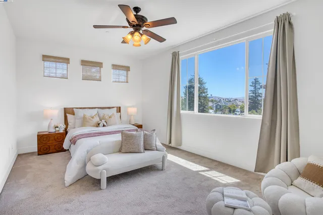 a bedroom with furniture and a window