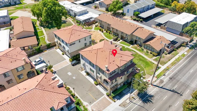an aerial view of a house with a garden