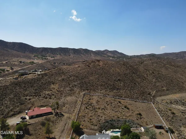 an aerial view of residential house and mountain view