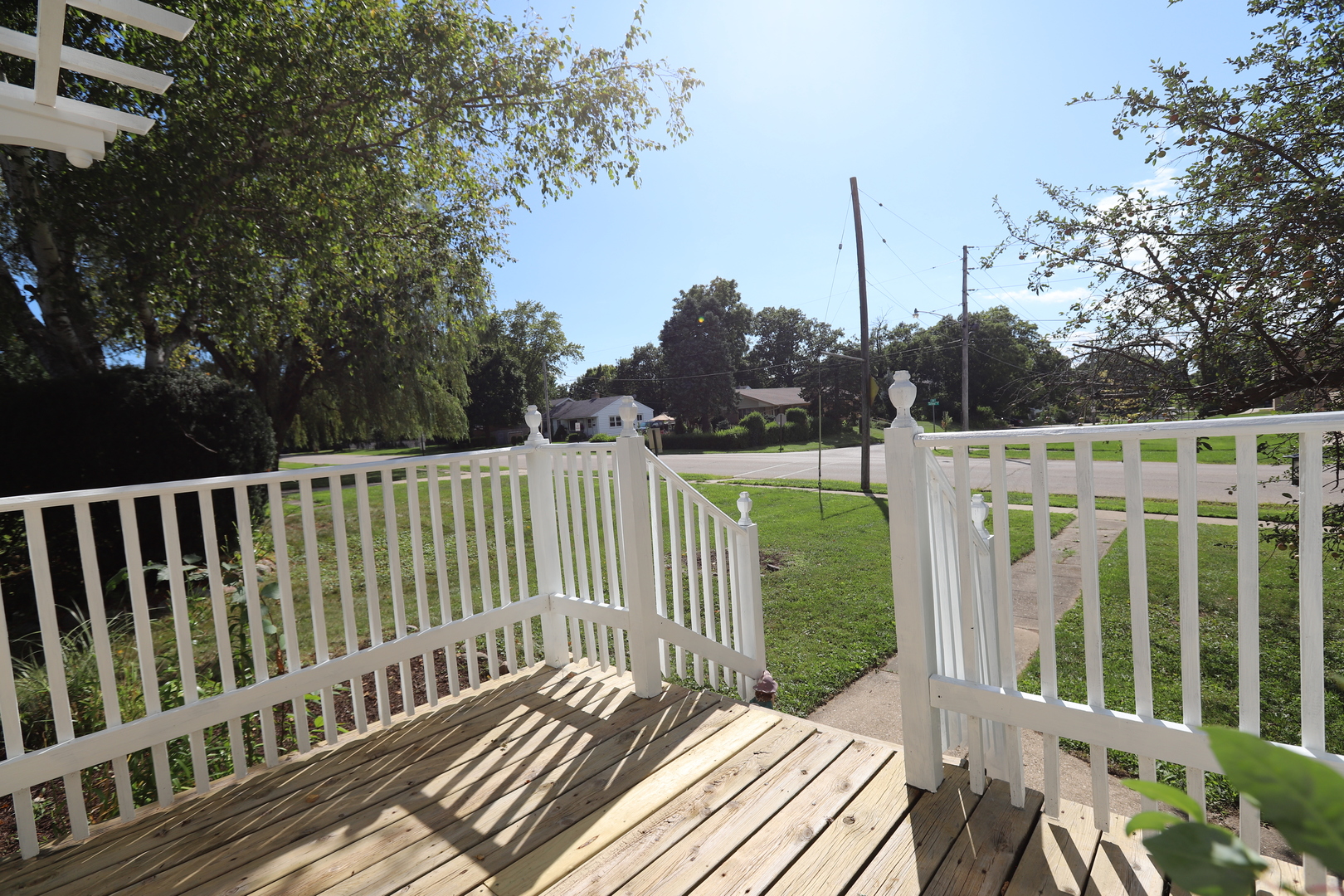 1103 Garfield Road Harvard, IL 60033 - Photo 16 of 28 a view of a wooden deck with a garden