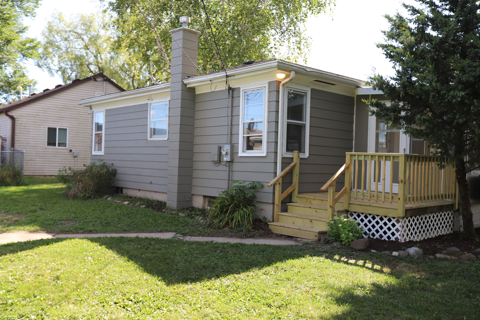 1103 Garfield Road Harvard, IL 60033 - Photo 18 of 28 a front view of a house with garden