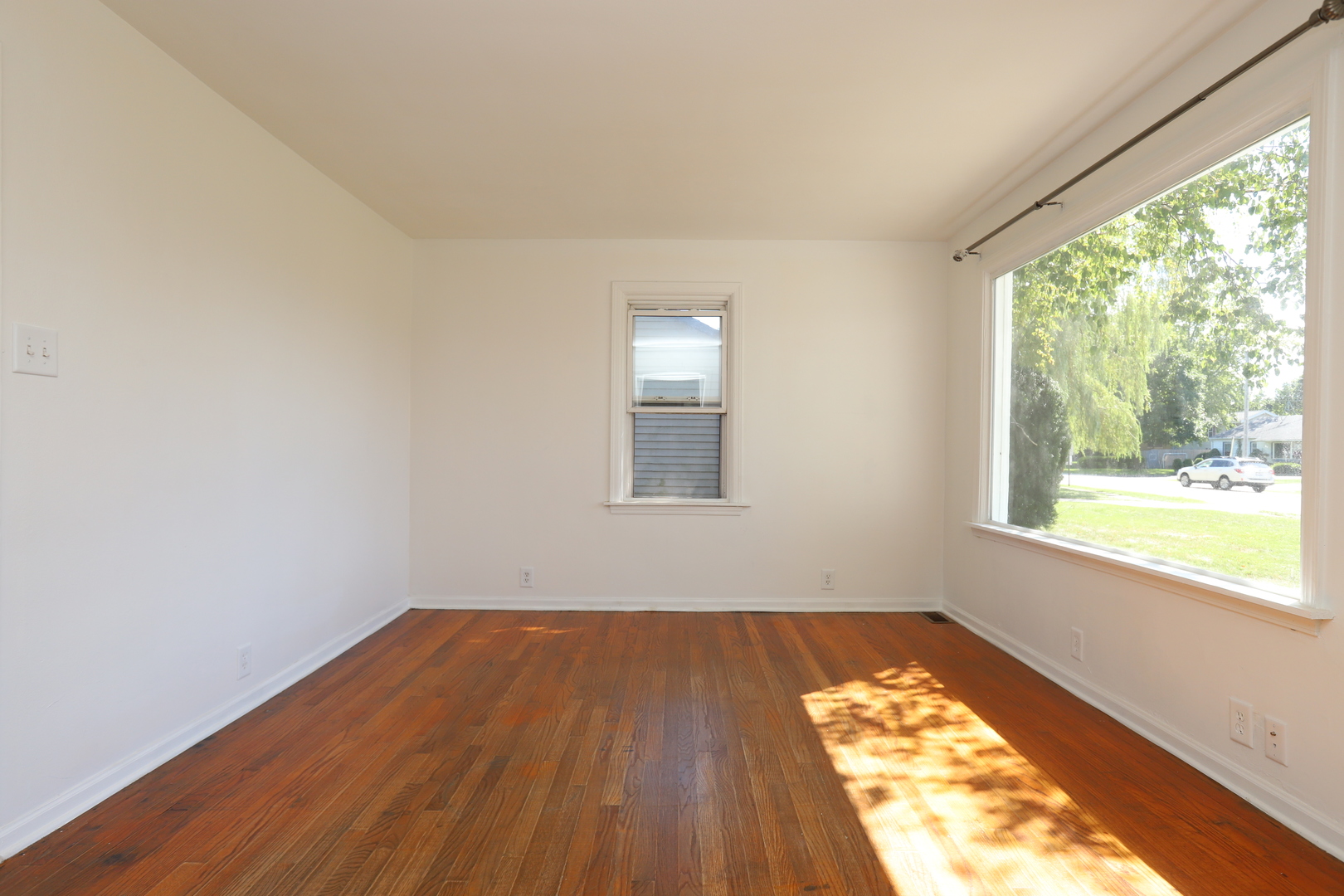 1103 Garfield Road Harvard, IL 60033 - Photo 6 of 28 a view of a room with wooden floor and window