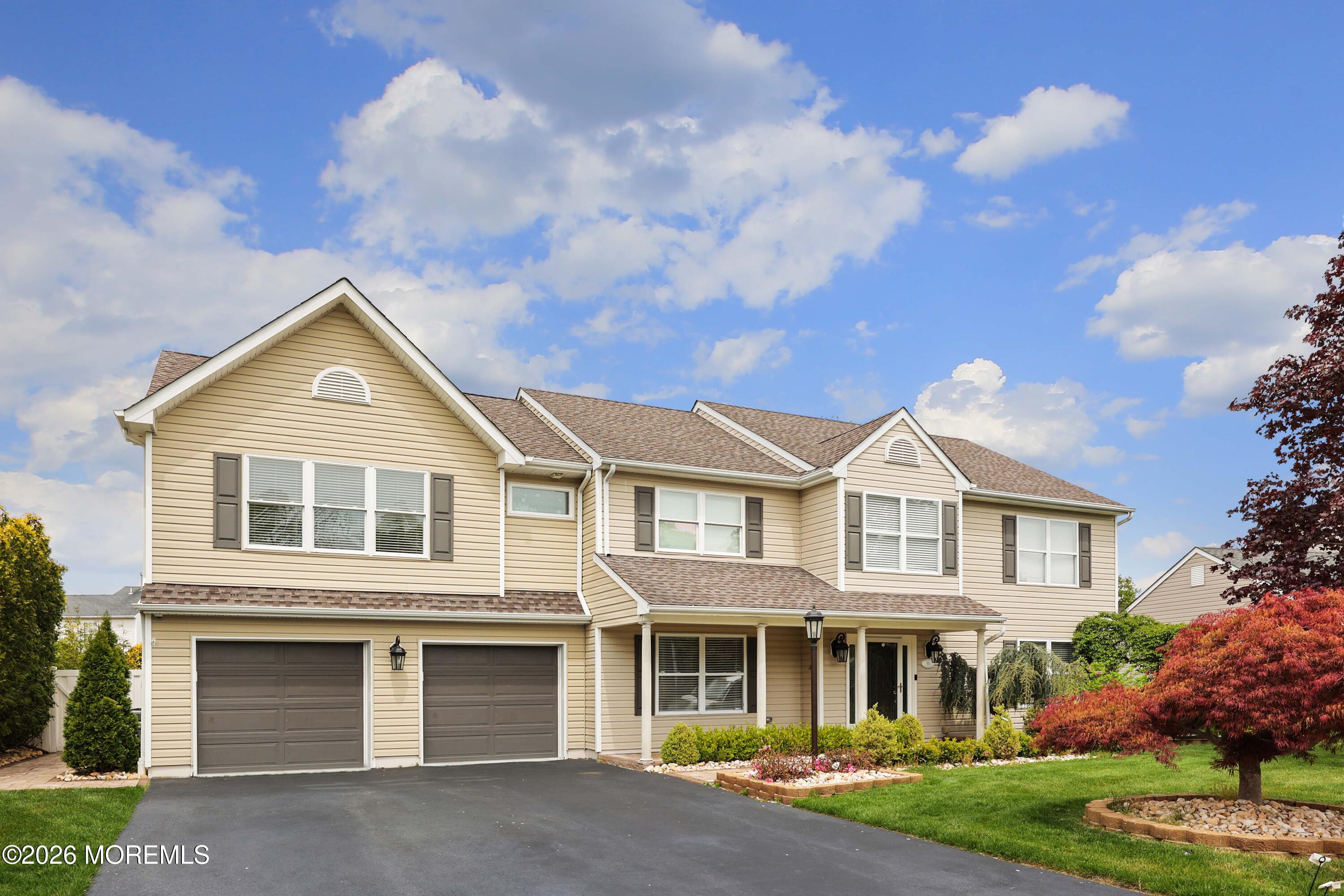 80 West Shenendoah Road Howell, NJ 07731 - Photo 1 of 34 a front view of a house with garden
