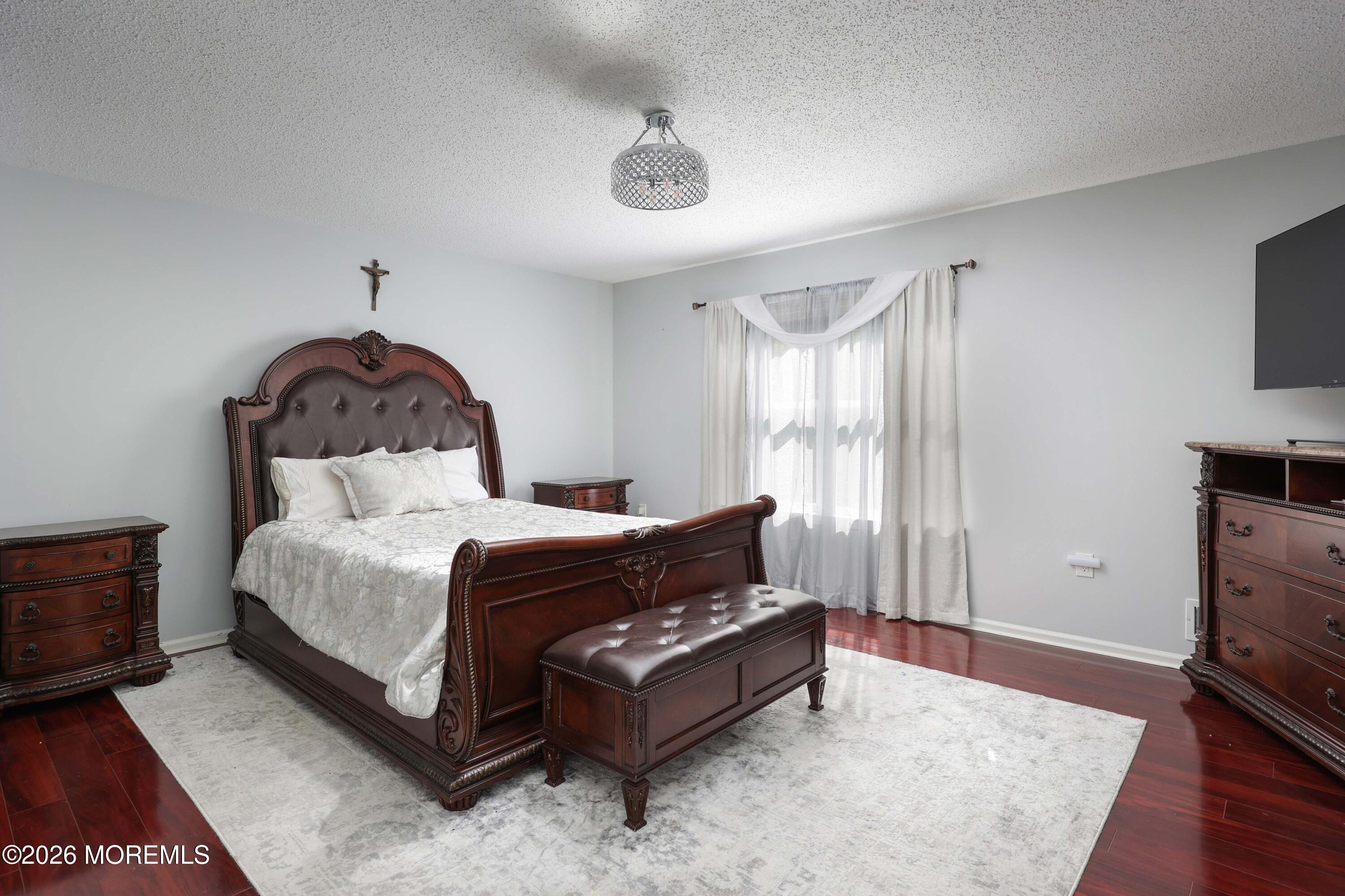 80 West Shenendoah Road Howell, NJ 07731 - Photo 16 of 34 a bed room with a bed and a television