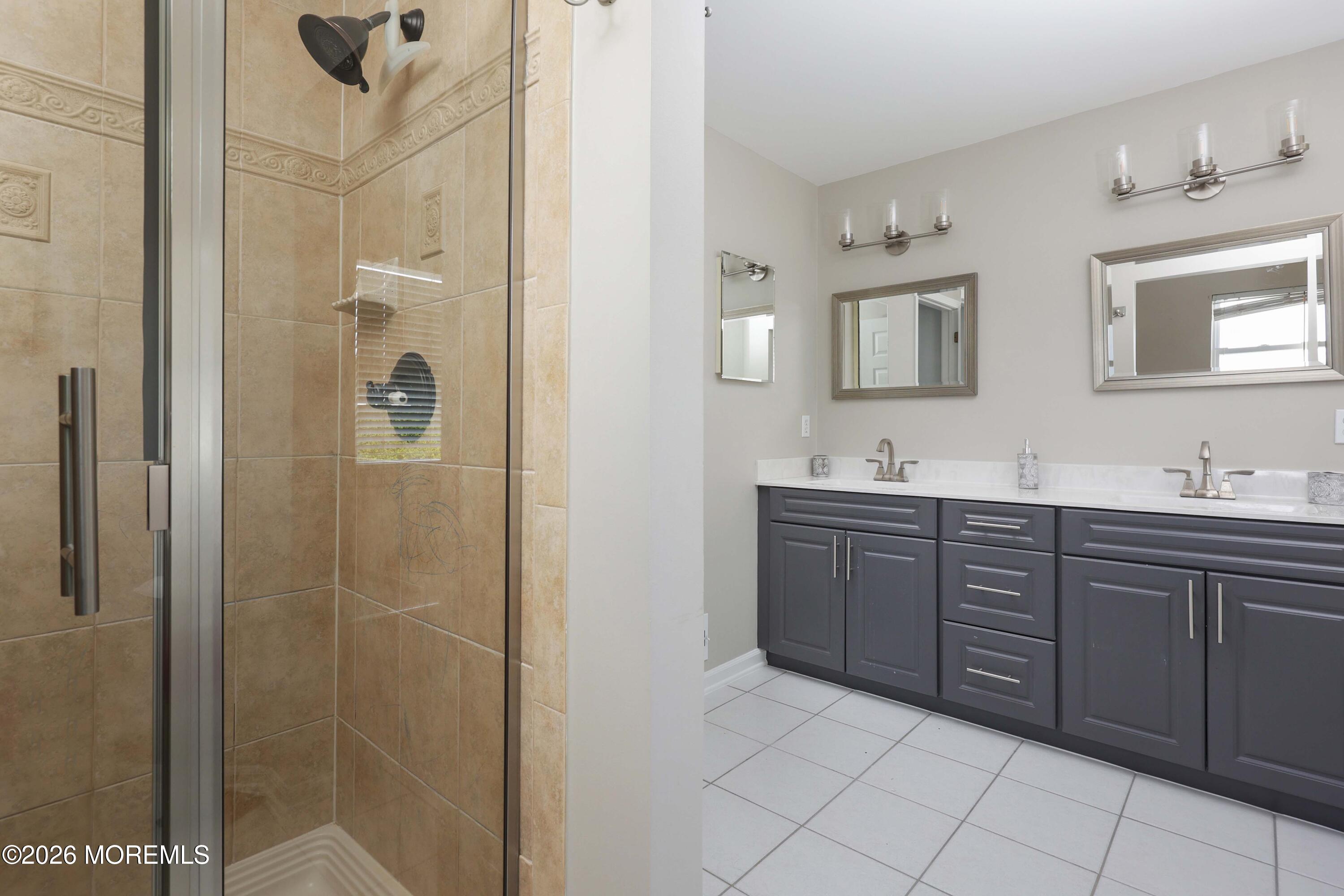 80 West Shenendoah Road Howell, NJ 07731 - Photo 20 of 34 a spacious bathroom with a shower a sink and mirror