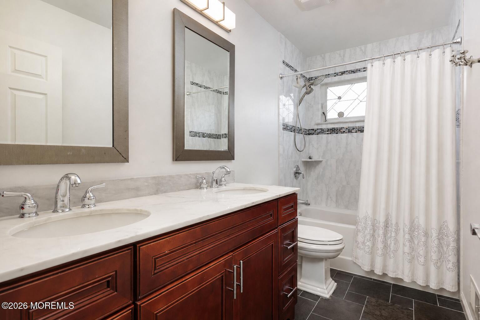 80 West Shenendoah Road Howell, NJ 07731 - Photo 23 of 34 a bathroom with a double vanity sink toilet mirror and shower