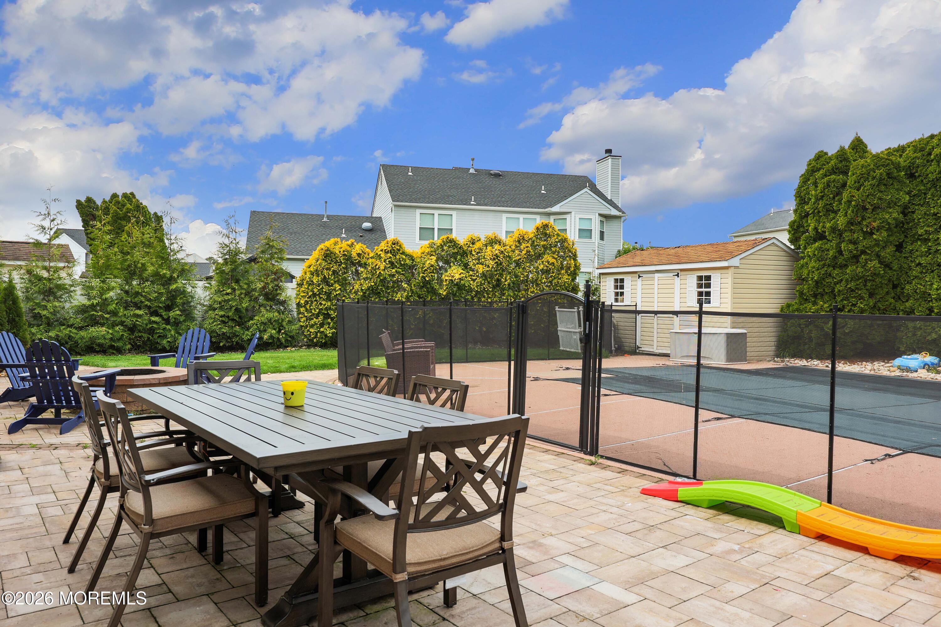 80 West Shenendoah Road Howell, NJ 07731 - Photo 26 of 34 a view of a backyard with a patio and outdoor seating