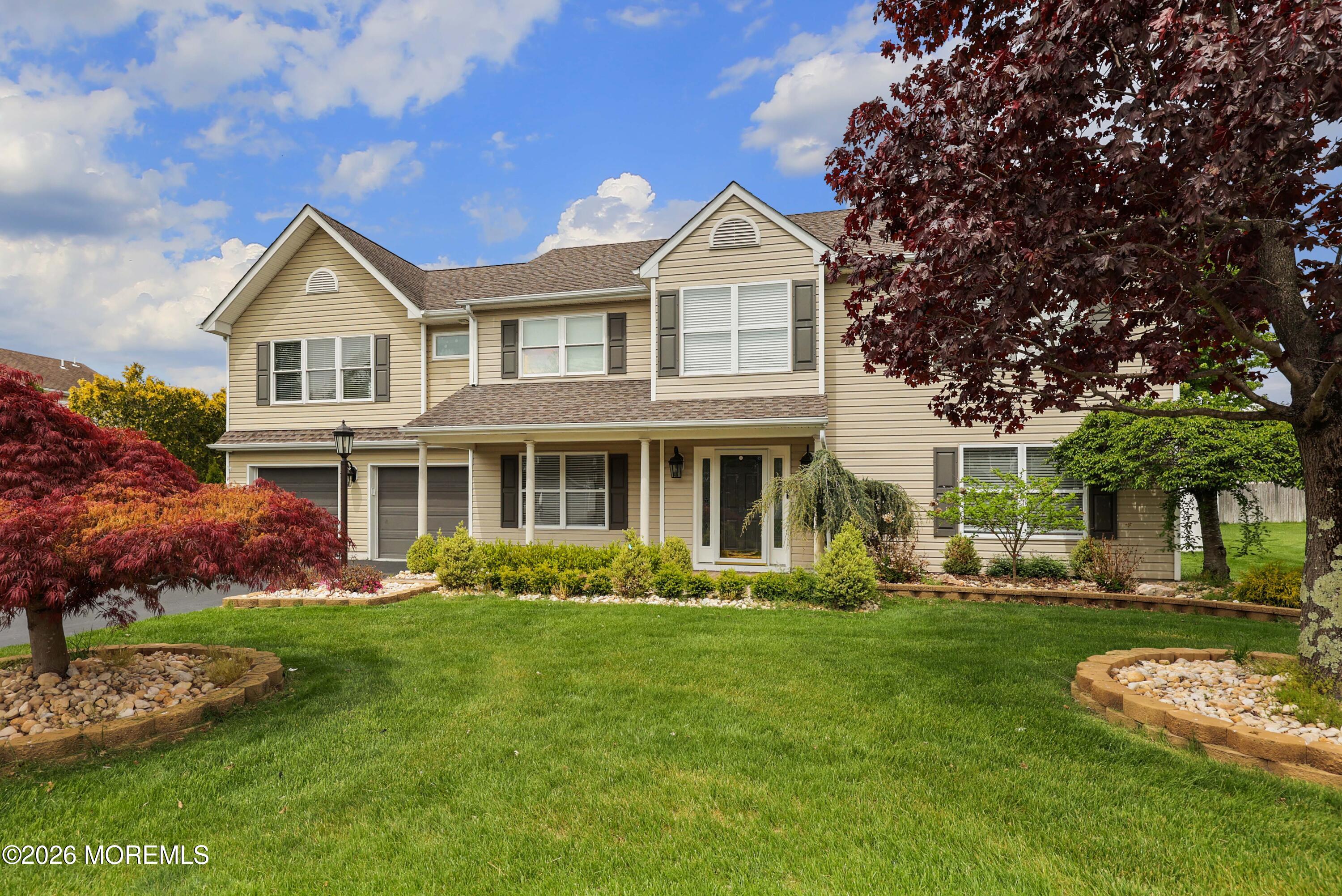80 West Shenendoah Road Howell, NJ 07731 - Photo 31 of 34 a front view of a house with a garden and trees