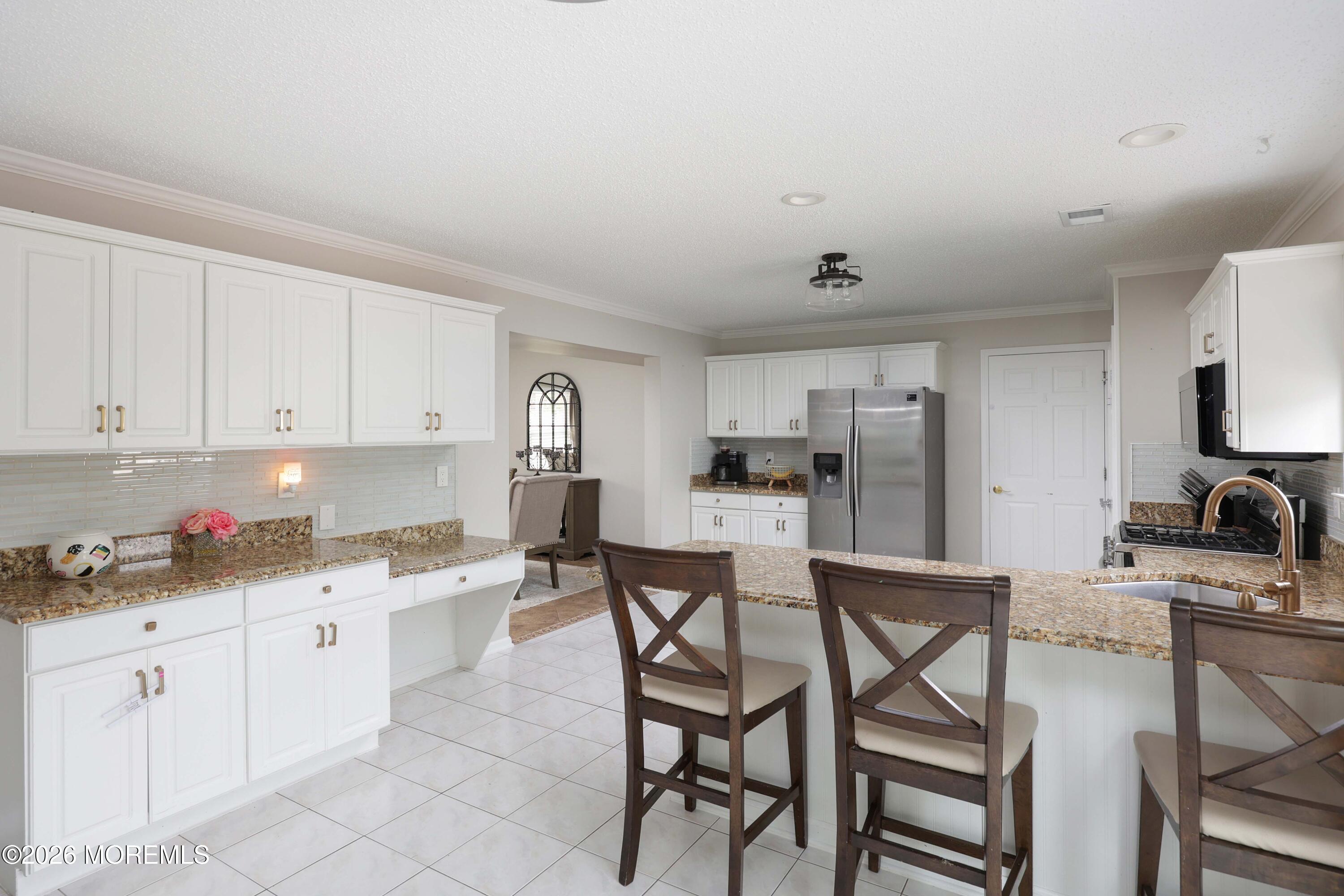 80 West Shenendoah Road Howell, NJ 07731 - Photo 7 of 34 a kitchen with a sink white cabinets and stainless steel appliances