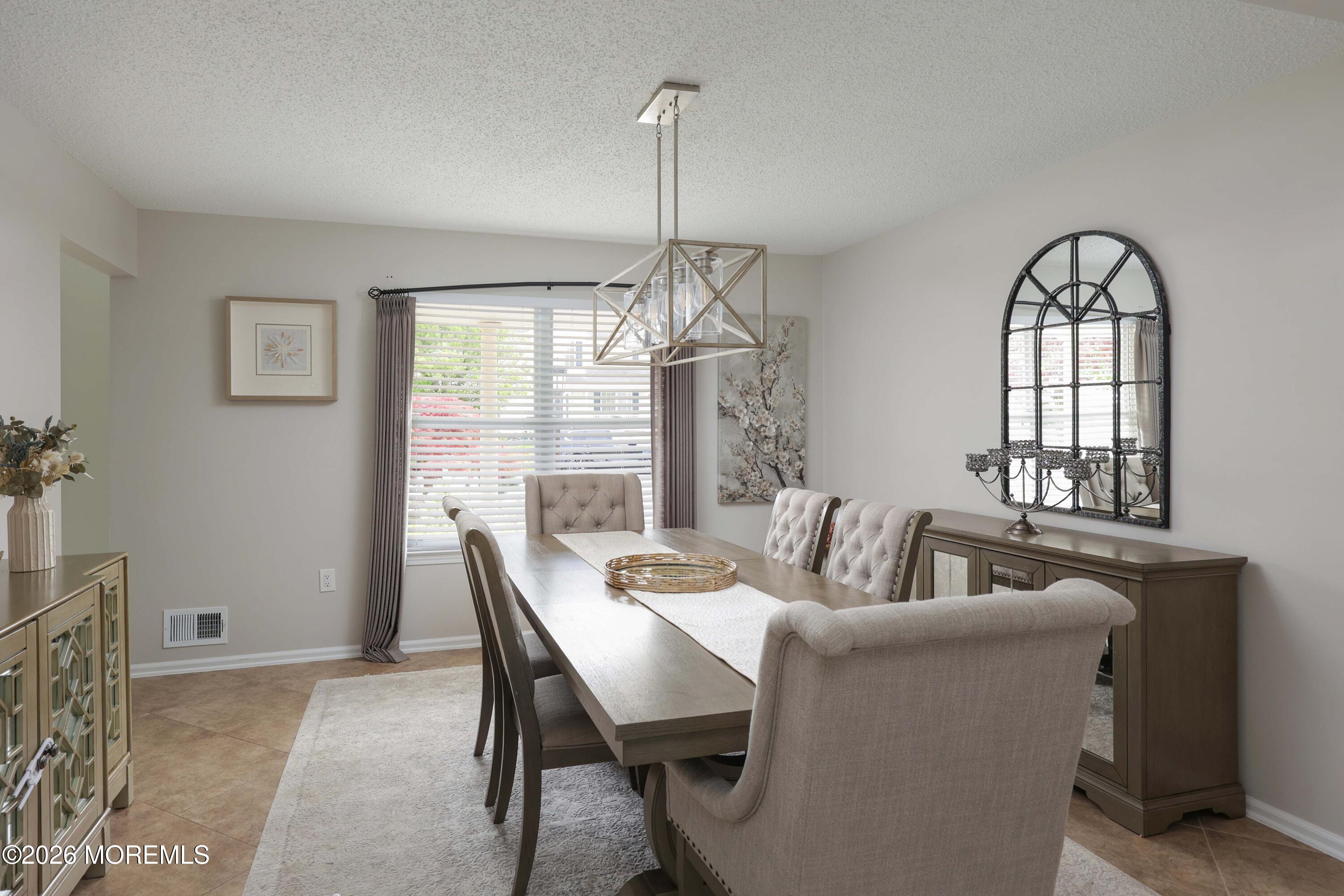 80 West Shenendoah Road Howell, NJ 07731 - Photo 10 of 34 a dining room with furniture a chandelier and window