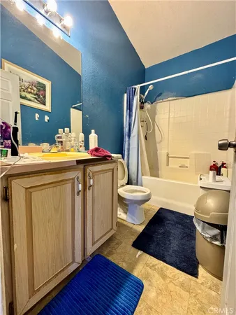 a room with pool table and chairs