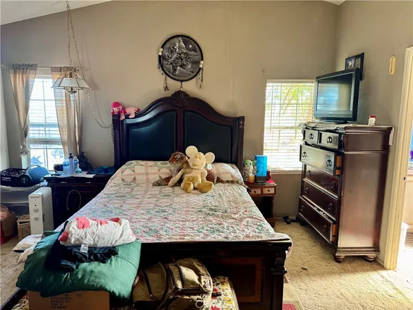 a kitchen with a stove a sink and a refrigerator