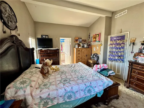 a white toilet sitting next to a small bathroom