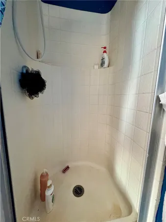 a kitchen with a stove a refrigerator and a sink