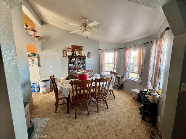 a kitchen with kitchen island granite countertop a stove and a sink