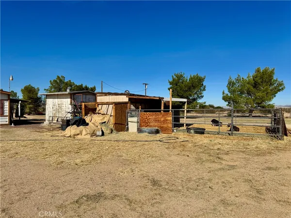 a view of a house with a barbeque