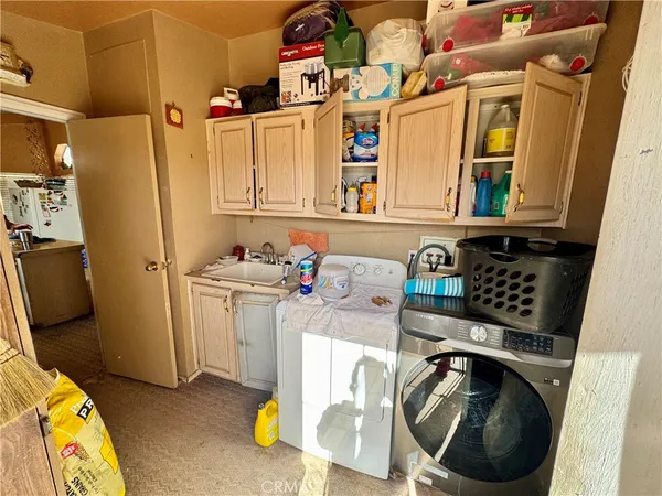 a bedroom with bed and a cabinets