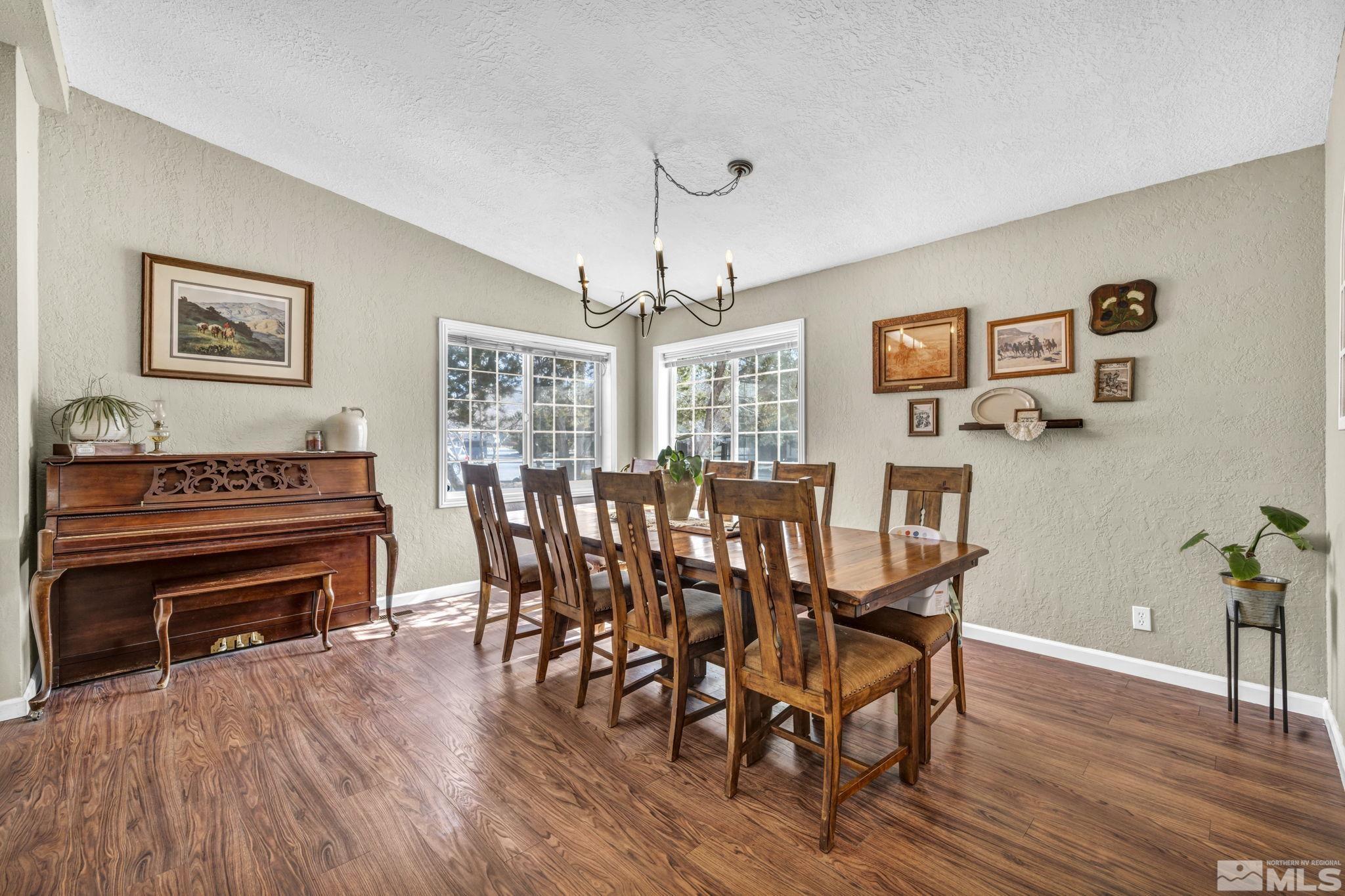 17345 Sunbird Lane Reno, NV 89508 - Photo 11 of 40 a view of a dining room with furniture window and wooden floor