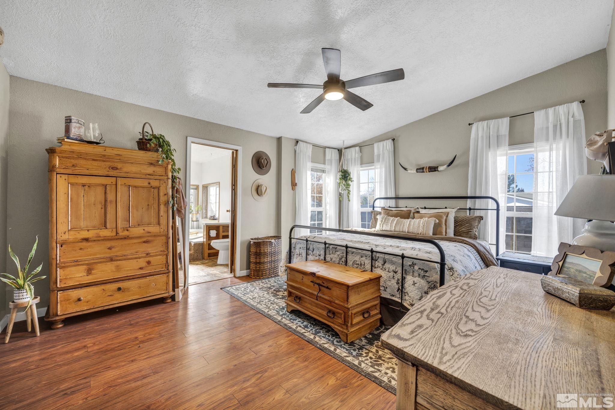 17345 Sunbird Lane Reno, NV 89508 - Photo 17 of 40 a bedroom with furniture and wooden floor