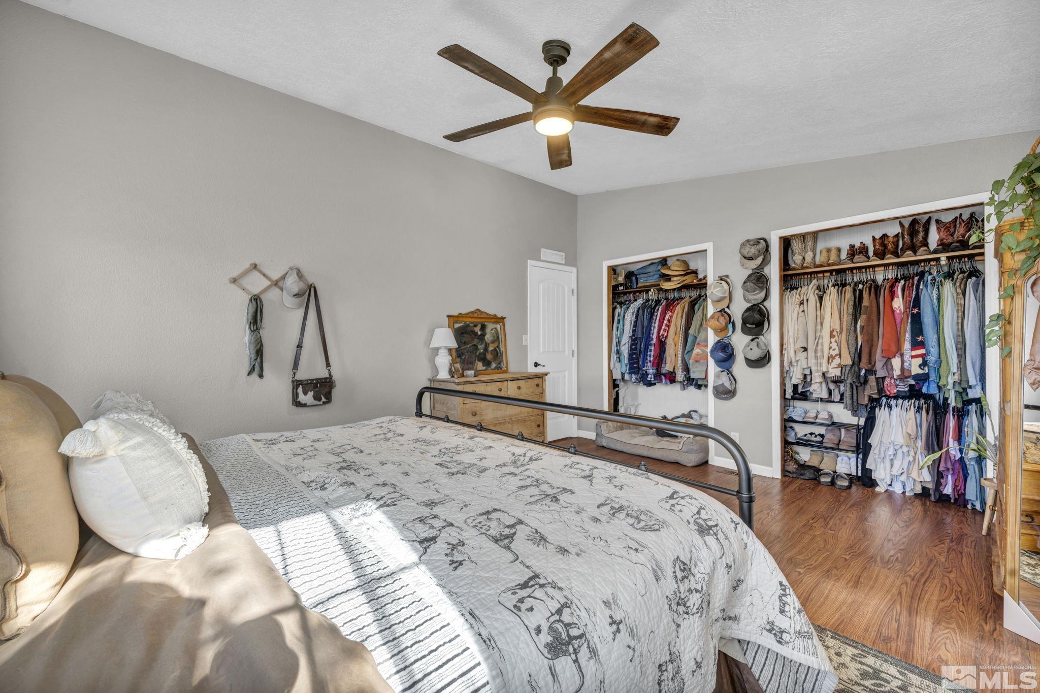 17345 Sunbird Lane Reno, NV 89508 - Photo 19 of 40 a bedroom with a bed and a walk in closet