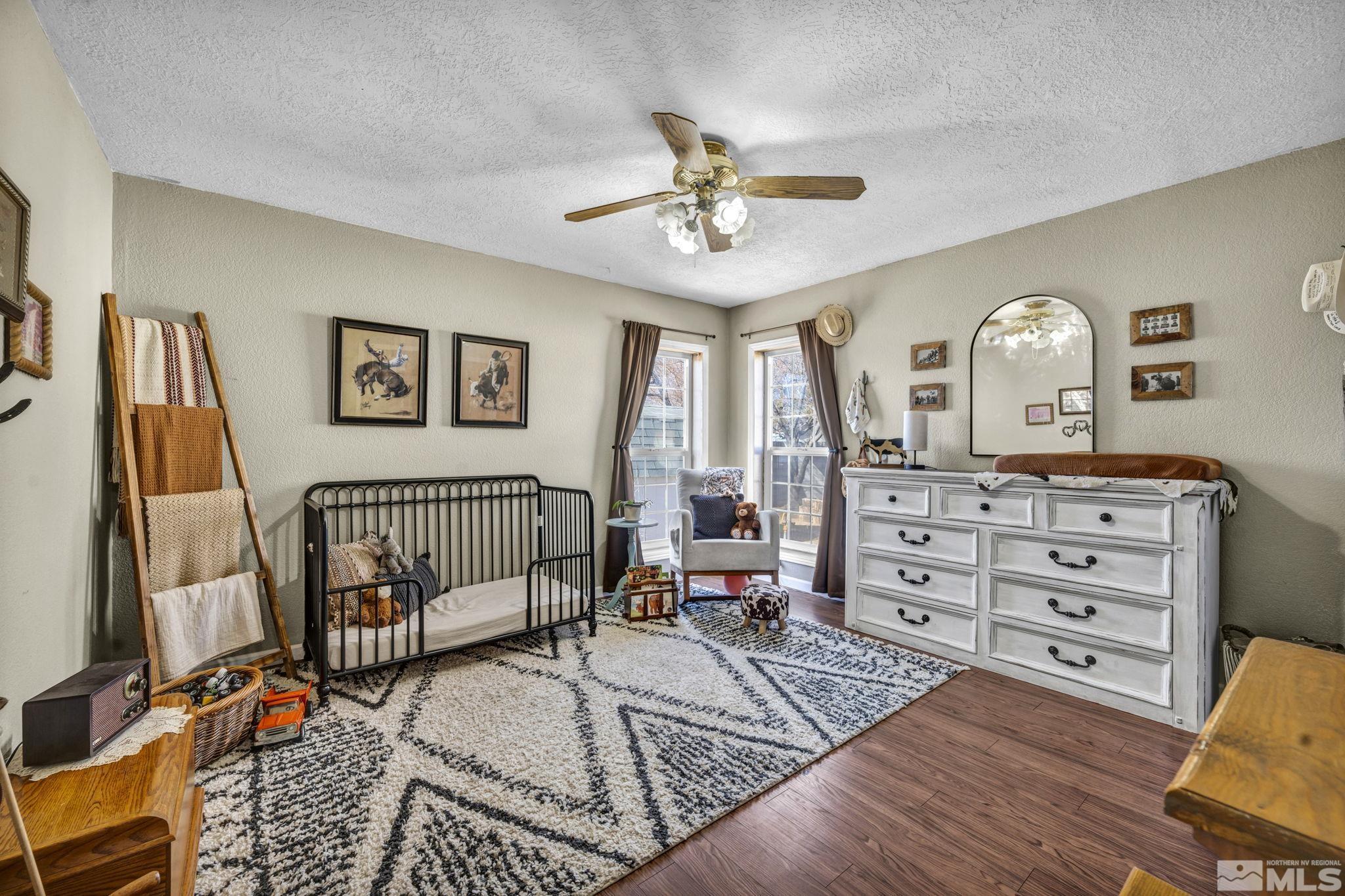 17345 Sunbird Lane Reno, NV 89508 - Photo 23 of 40 a bedroom with furniture and a window