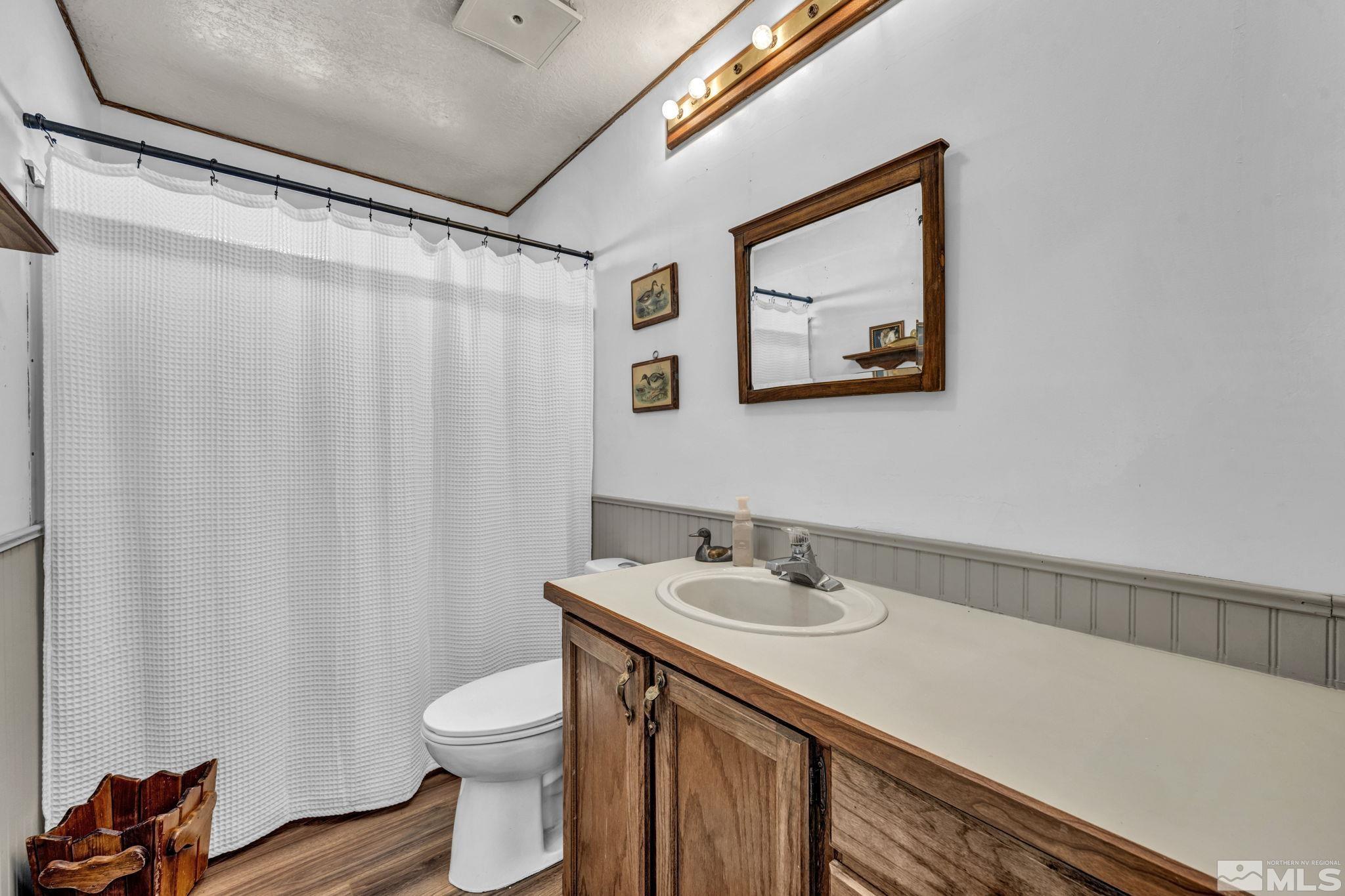 17345 Sunbird Lane Reno, NV 89508 - Photo 24 of 40 a bathroom with a sink vanity and toilet