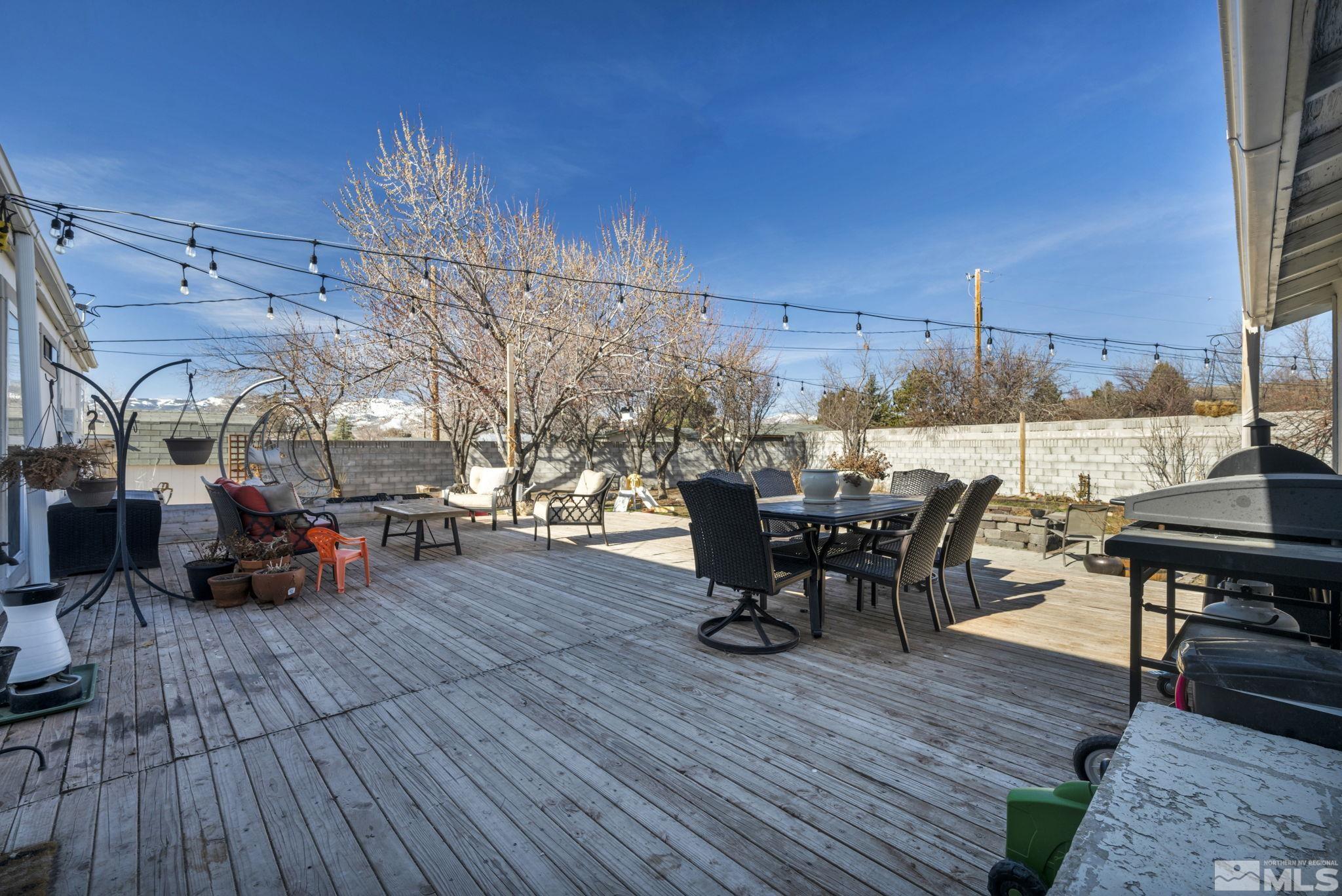 17345 Sunbird Lane Reno, NV 89508 - Photo 31 of 40 a view of a dinning table and chairs in the patio