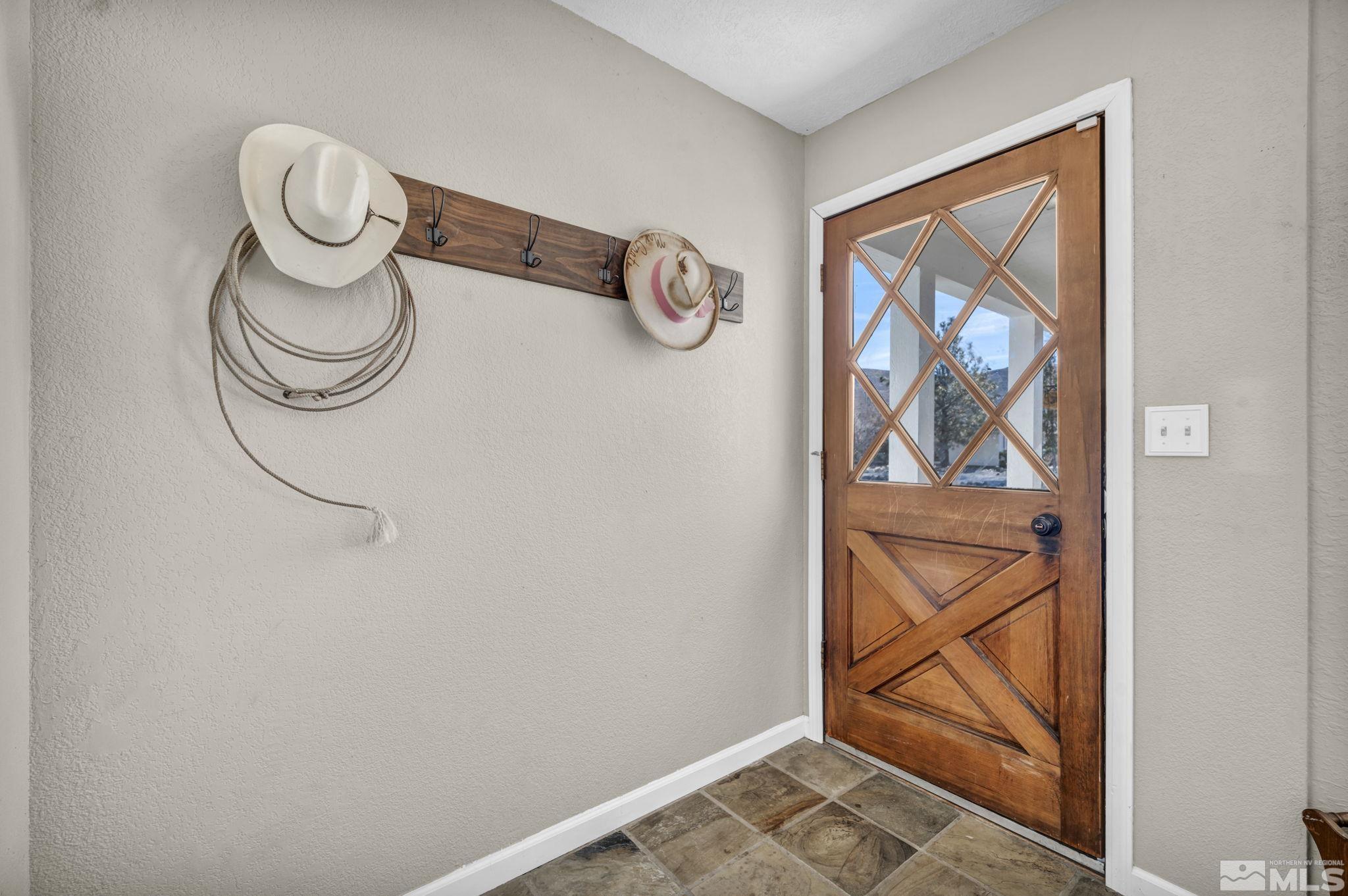 17345 Sunbird Lane Reno, NV 89508 - Photo 4 of 40 a view of light fixtures and a window in a room
