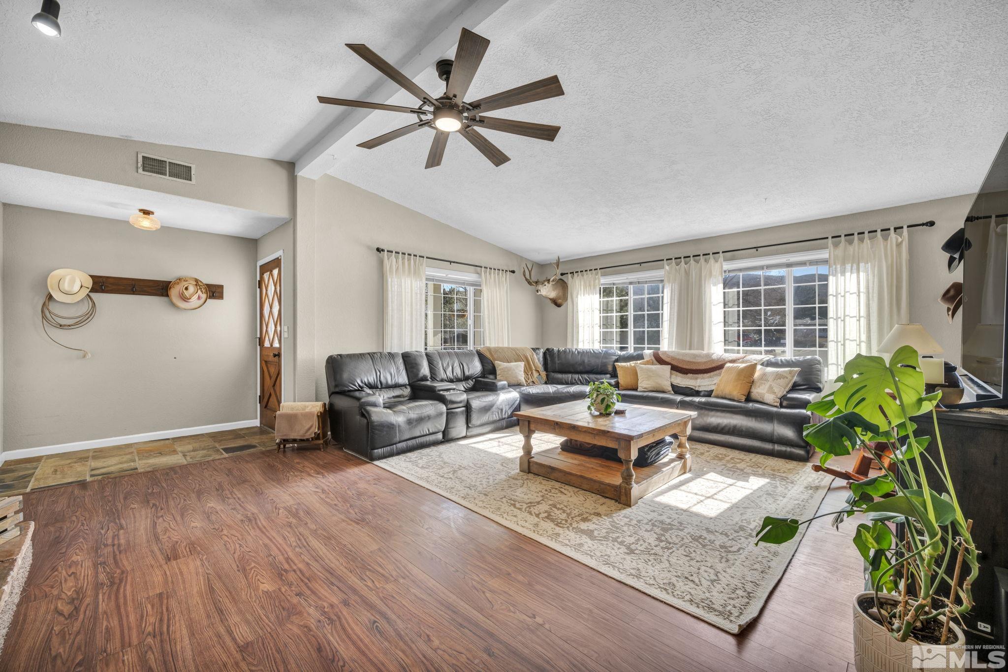 17345 Sunbird Lane Reno, NV 89508 - Photo 5 of 40 a living room with furniture and a wooden floor
