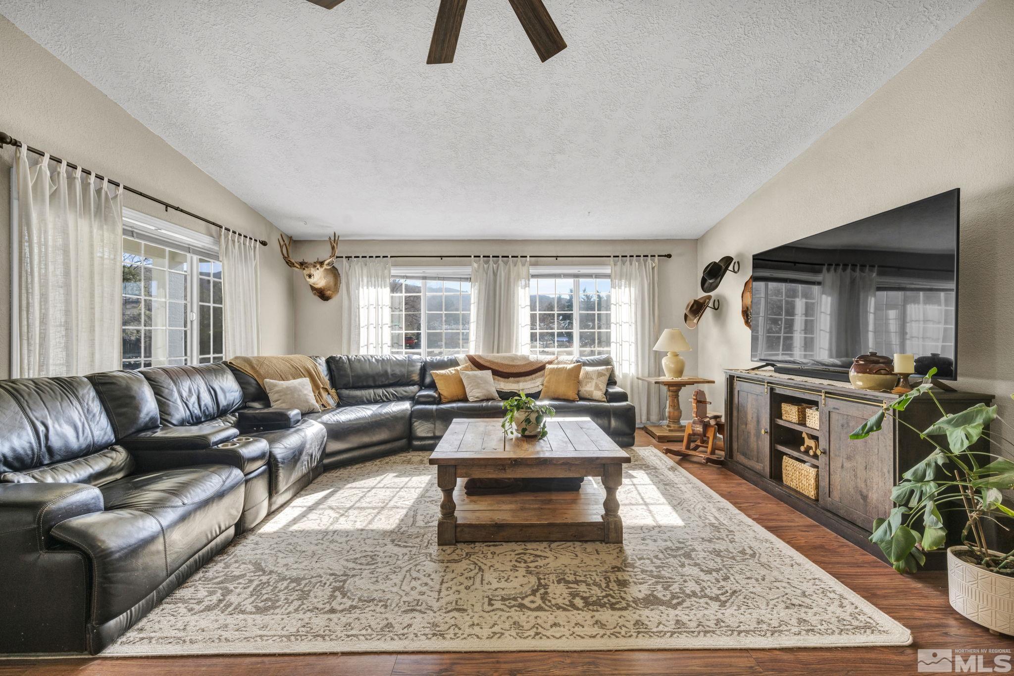 17345 Sunbird Lane Reno, NV 89508 - Photo 9 of 40 a living room with furniture and a flat screen tv