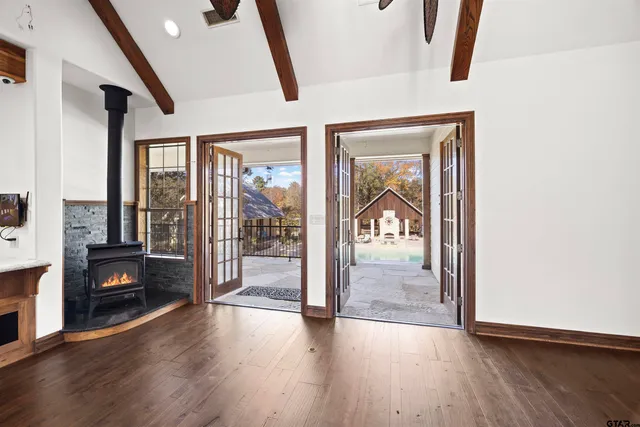 a bathroom with a granite countertop sink a toilet and a mirror