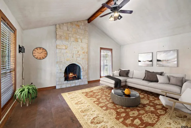 an aerial view of a house with a swimming pool