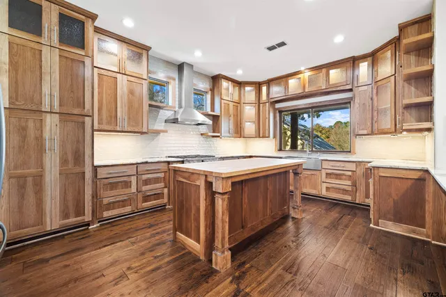 a kitchen with a stove and a sink