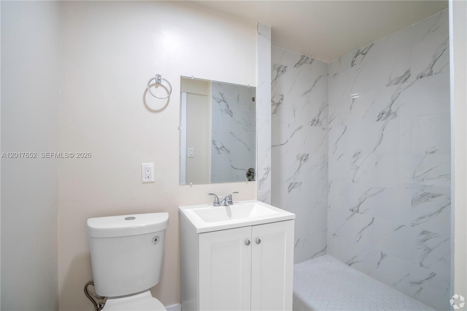 433 Southwest 6th Street, Unit 15 Miami, FL 33130 - Photo 7 of 12 a bathroom with a sink a toilet and shower