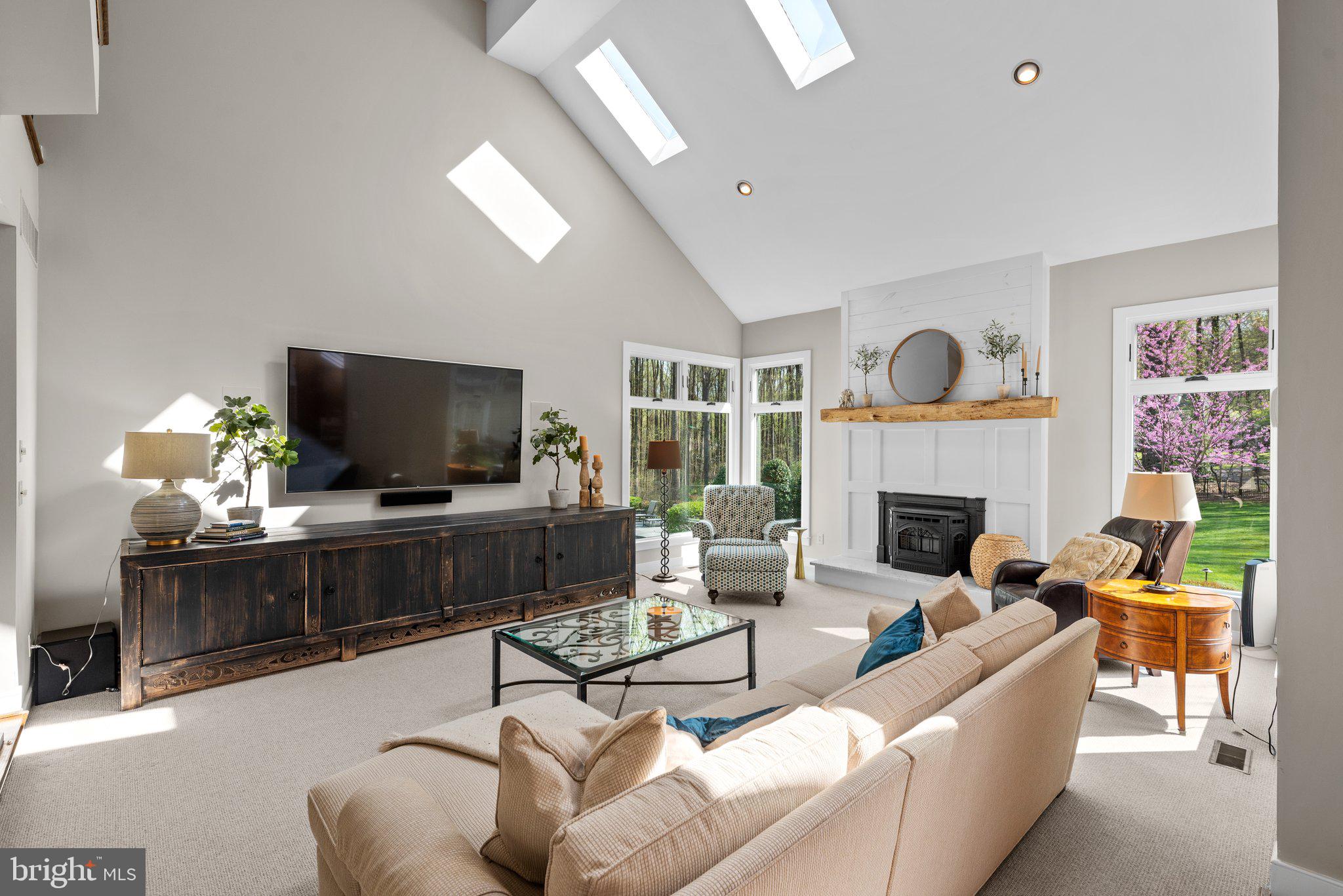 13791 Lakeside Drive Clarksville, MD 21029 - Photo 16 of 90 a living room with furniture a flat screen tv and a fireplace