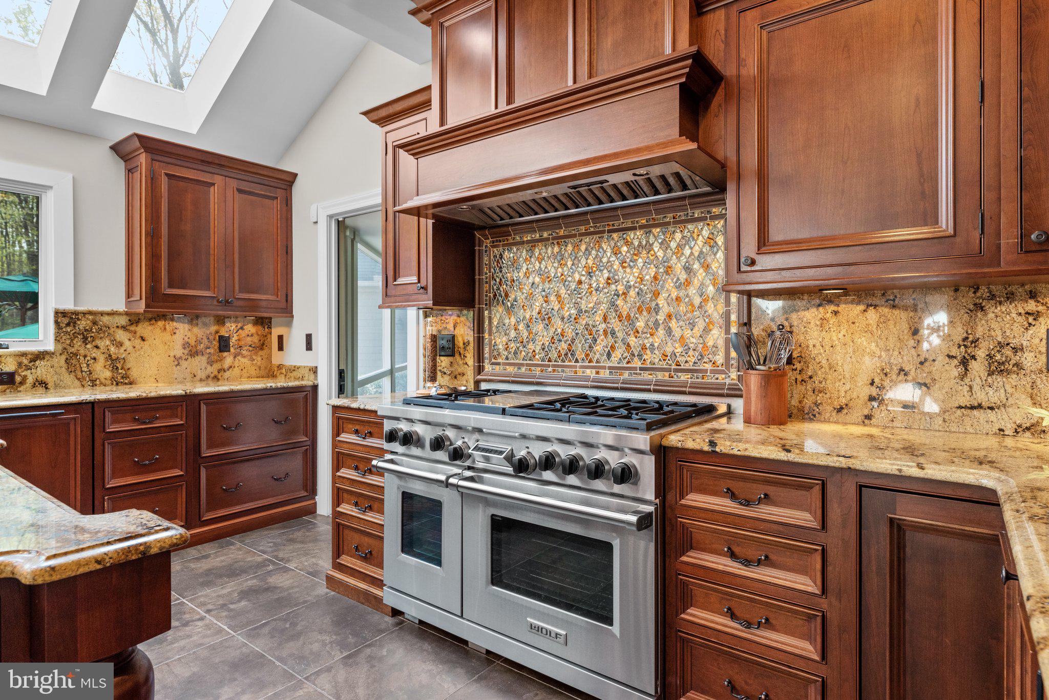13791 Lakeside Drive Clarksville, MD 21029 - Photo 23 of 90 a kitchen with a stove and white cabinets