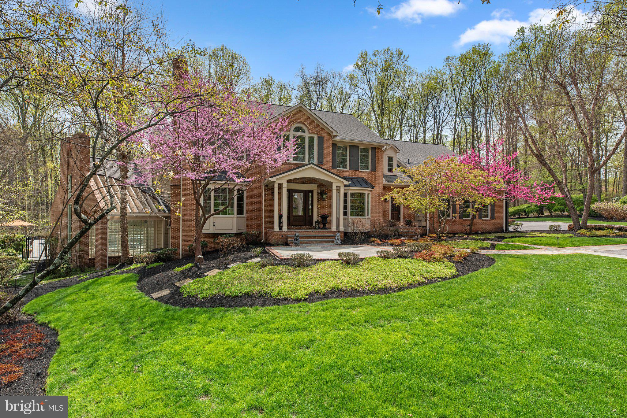 13791 Lakeside Drive Clarksville, MD 21029 - Photo 4 of 90 a front view of a house with swimming pool and garden
