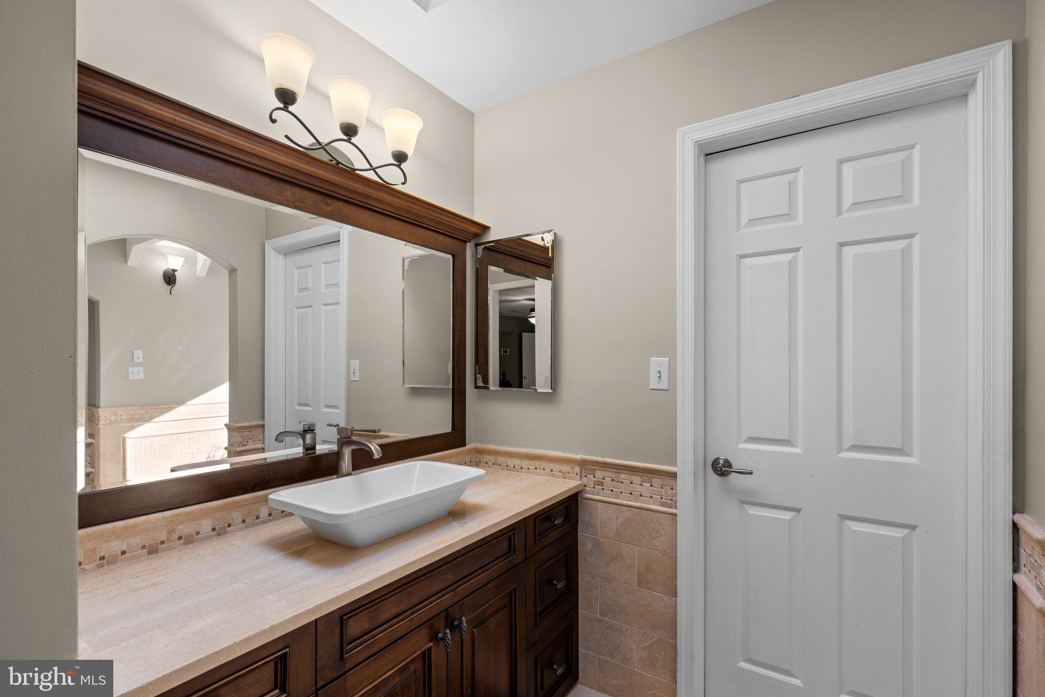 13791 Lakeside Drive Clarksville, MD 21029 - Photo 45 of 90 a bathroom with a sink and a mirror