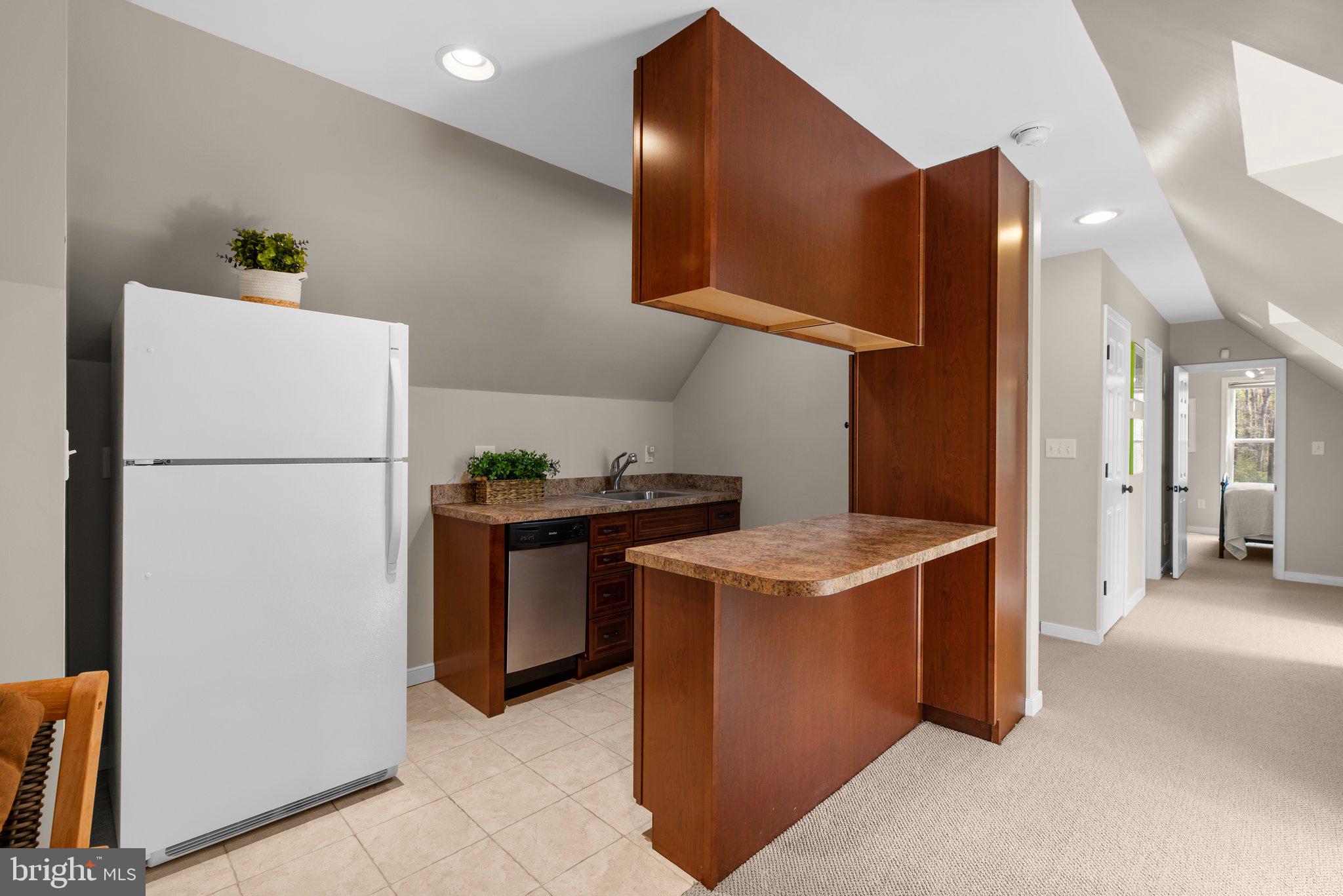 13791 Lakeside Drive Clarksville, MD 21029 - Photo 61 of 90 a kitchen with stainless steel appliances granite countertop a refrigerator and a stove