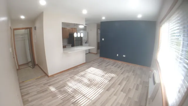 a kitchen with a refrigerator and a sink